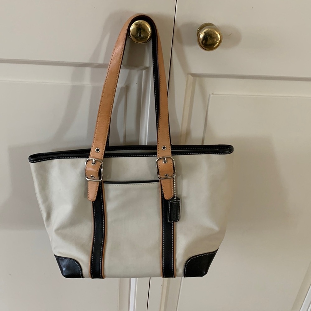 Coach handbag treated canvas with leather trim and straps with brass buckle trim